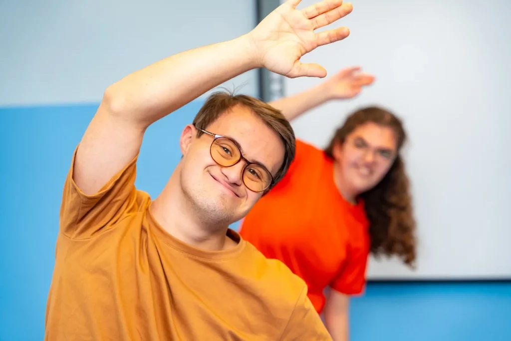 Young man with Down syndrome dancing joyfully