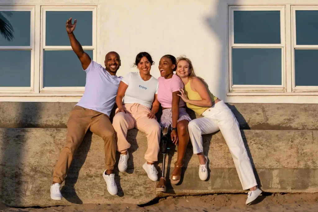 Group of friends including person with disability outdoors