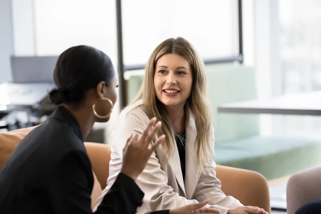 Two women in professional conversation